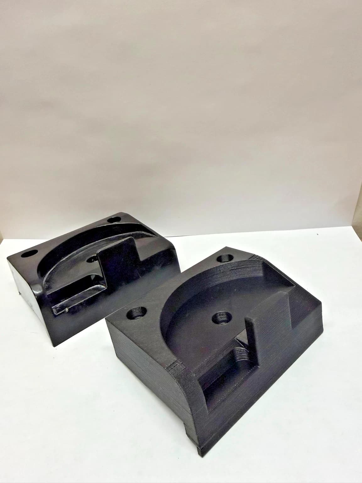 NRP-CHB-001 lower door catch housing beside an original housing