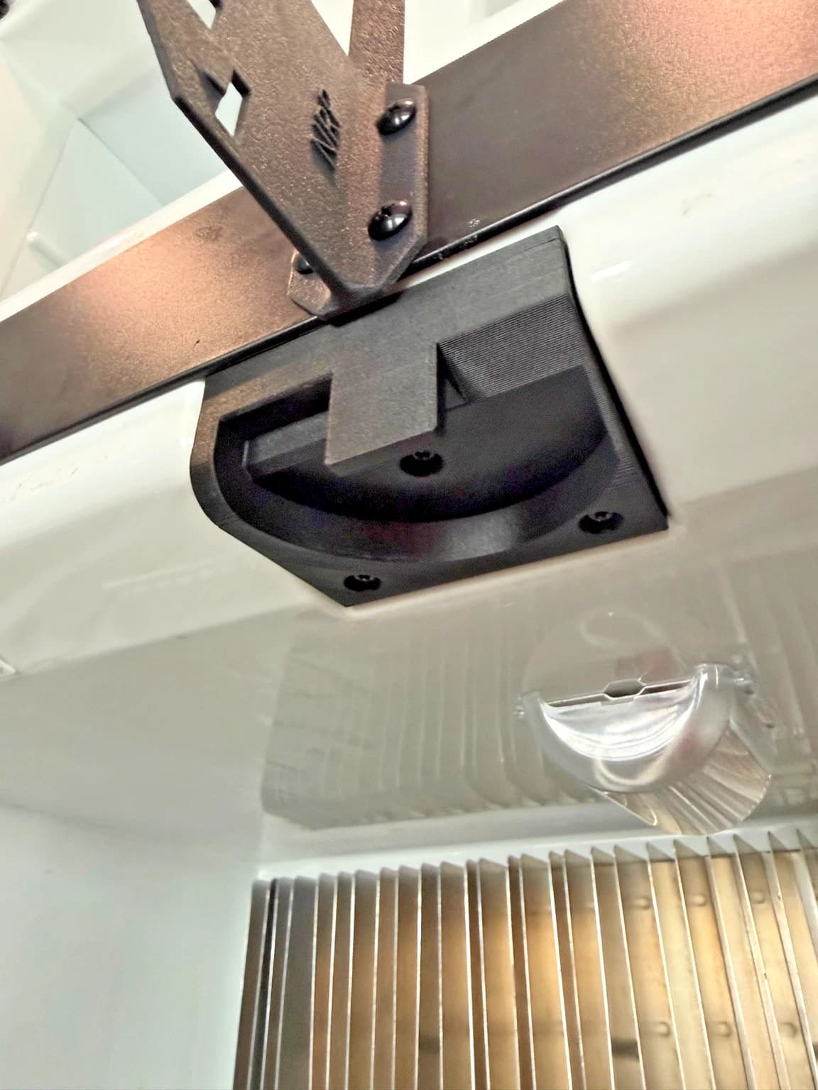 NRP-CHT-001 upper door catch housing installed in a refrigerator