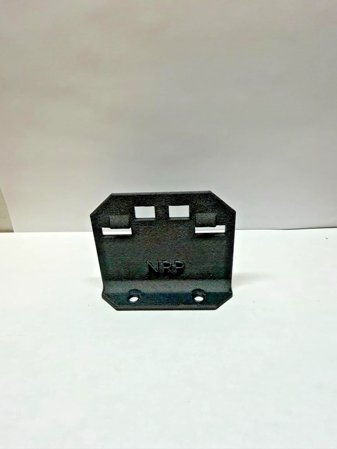 Front view of the NRP-SP-001 refrigerator flapper strike plate